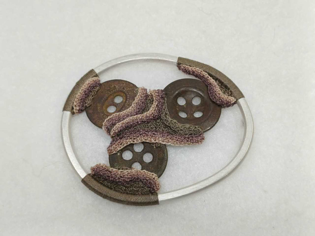Old buttons brooch
